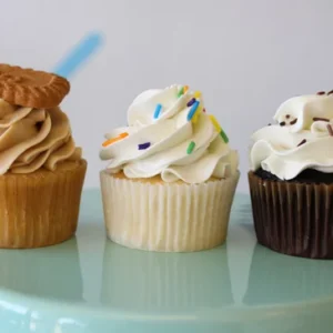 Cupcakes with various toppings on stand