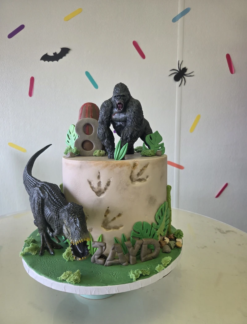 Dinosaur and gorilla themed birthday cake